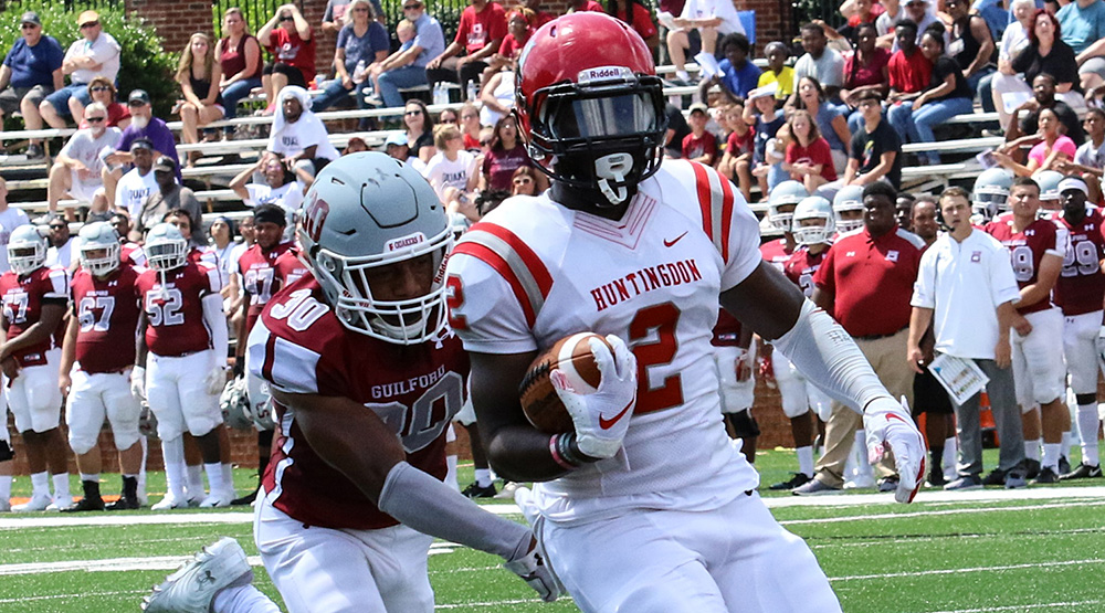 Otis Porter makes the catch ahead of a Guilford defender on Saturday, Sept. 1, well before the weather became an issue. Photo for Huntingdon athletics by Carrie Bump.