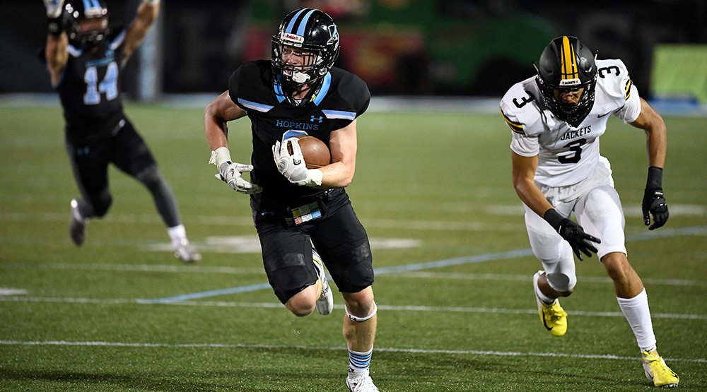 Macauley Kilbane runs away from a Randolph-Macon player en route to a 34-yard interception return for a touchdown. (Johns Hopkins athletics photo)