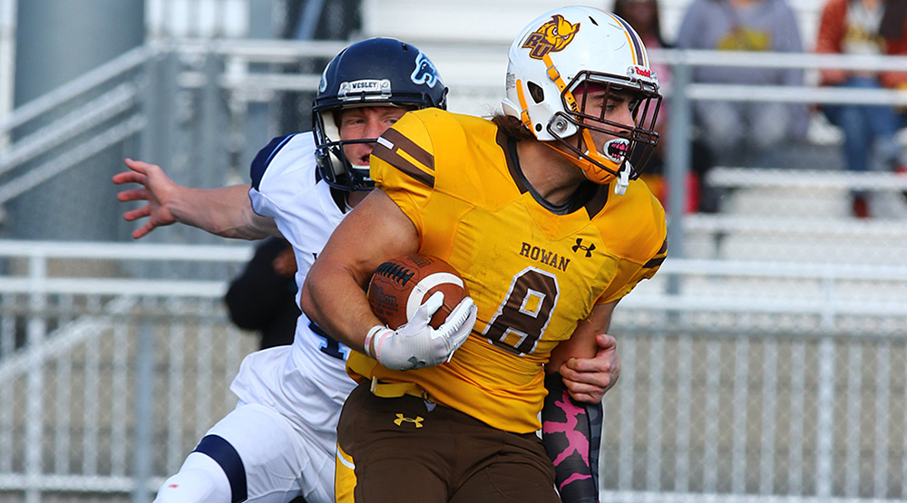 John Mannion breaks a Wesley tackle. (Wesley athletics photo)