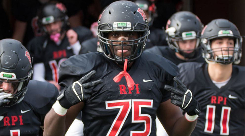 Reuben Clarke running out with the RPI football team.